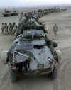 Click on the December 14th photo of U.S. marines in a convoy to Kandahar for a larger image.